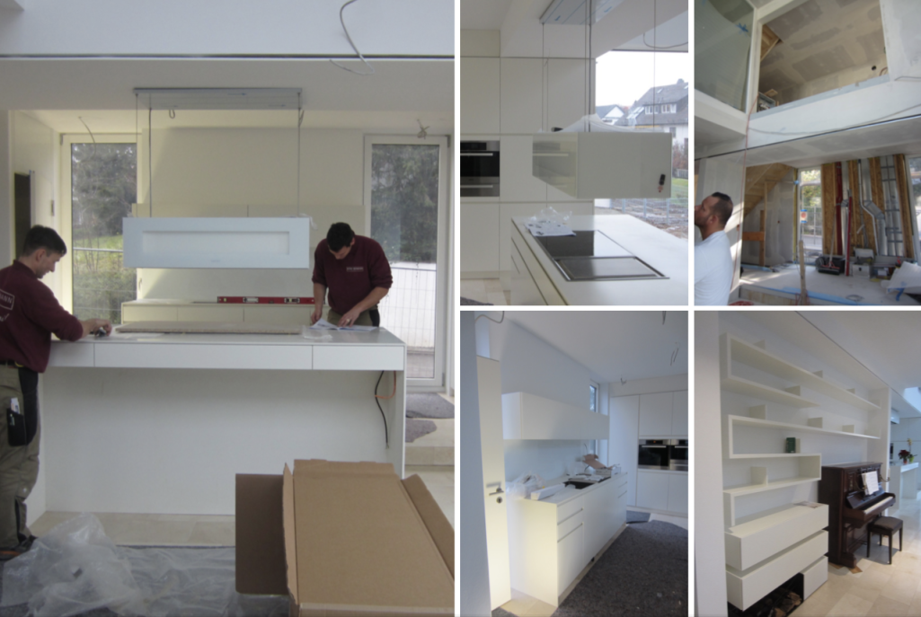 Moderne Kücheneinrichtung mit weißen Möbeln und Arbeitsflächen, Installation in Arbeit.