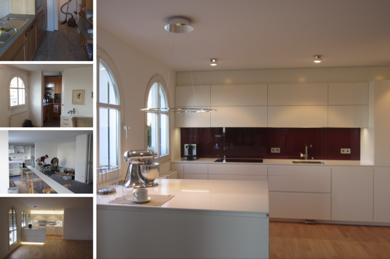 Moderne Küche mit weißen Möbeln, roter Wand und Holzfußboden. Schlichte, elegante Gestaltung.