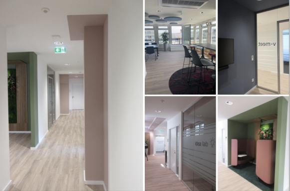 Moderne Büroräume mit hellen Wänden, Holzboden und verschiedenen Arbeitsbereichen.